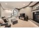 Finished basement featuring a fireplace, living area with TV, and stairs to the upper level at 519 S Gaylord St, Denver, CO 80209