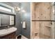 Elegant bathroom with tiled walk-in shower and a stylish vanity with a vessel sink at 519 S Gaylord St, Denver, CO 80209