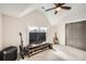 Cozy bedroom with ceiling fan, large window, and entertainment setup with guitar and bass at 519 S Gaylord St, Denver, CO 80209