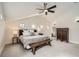 Inviting bedroom with vaulted ceiling, ceiling fan, and ample natural light at 519 S Gaylord St, Denver, CO 80209