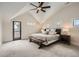 Serene bedroom featuring vaulted ceilings, a ceiling fan, and access to a private balcony at 519 S Gaylord St, Denver, CO 80209