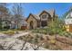 Charming home with manicured front yard, landscaped garden, and a welcoming covered porch entry at 519 S Gaylord St, Denver, CO 80209