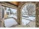 View from stone porch towards the street in this home showcasing its charm at 519 S Gaylord St, Denver, CO 80209