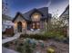 Charming brick and stone home with manicured front yard and inviting covered porch at 519 S Gaylord St, Denver, CO 80209