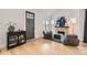 Charming living room with stone fireplace, hardwood floors, and a stylish display cabinet by the entry at 519 S Gaylord St, Denver, CO 80209