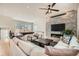 Open living room with hardwood floors, a fireplace with tv, a billiard table, and modern design at 519 S Gaylord St, Denver, CO 80209