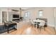 Open-concept living space featuring a modern fireplace, built-in shelving, and dining area at 519 S Gaylord St, Denver, CO 80209