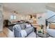 Open-concept living room showcasing hardwood floors, neutral tones, and a glimpse into the modern kitchen at 519 S Gaylord St, Denver, CO 80209