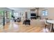 Spacious living room filled with natural light, featuring a modern fireplace and hardwood floors at 519 S Gaylord St, Denver, CO 80209