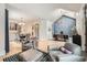 Open living room flows into the dining and office areas, features hardwood floors, and neutral tones at 519 S Gaylord St, Denver, CO 80209