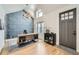 Bright office featuring a vaulted ceiling, custom wall design, modern desk and decor, and hardwood floors at 519 S Gaylord St, Denver, CO 80209
