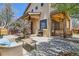 Cozy patio with a seating area, grill, and blossoming tree, perfect for outdoor entertaining at 519 S Gaylord St, Denver, CO 80209