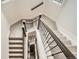 Carpeted staircase with dark railing and white walls at 519 S Gaylord St, Denver, CO 80209