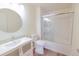 Clean bathroom features modern vanity, stylish sink, and a glass-enclosed shower and tub at 3250 E 103Rd Pl # 805, Thornton, CO 80229
