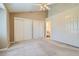 Bright and airy bedroom with two large closets, ceiling fan, and neutral color palette at 3250 E 103Rd Pl # 805, Thornton, CO 80229