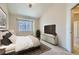 Inviting bedroom featuring neutral decor, cozy carpeting, and a large window at 3250 E 103Rd Pl # 805, Thornton, CO 80229