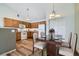 Dining Area with wood floors, modern lighting, and a view into the kitchen at 3250 E 103Rd Pl # 805, Thornton, CO 80229