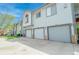Modern condo building with attached garages offers convenient parking and stylish exterior design at 3250 E 103Rd Pl # 805, Thornton, CO 80229