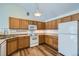 Modern kitchen with ample counter space and wood cabinets at 3250 E 103Rd Pl # 805, Thornton, CO 80229