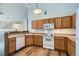 Well-equipped kitchen featuring wood cabinets and modern appliances at 3250 E 103Rd Pl # 805, Thornton, CO 80229