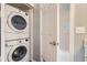 Convenient laundry area features a stacked washer and dryer, maximizing space and efficiency at 3250 E 103Rd Pl # 805, Thornton, CO 80229