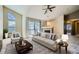 Bright living room features a sliding glass door, fireplace, and comfortable seating at 3250 E 103Rd Pl # 805, Thornton, CO 80229