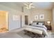 Spacious main bedroom with ensuite bathroom, high ceilings, and a ceiling fan at 3250 E 103Rd Pl # 805, Thornton, CO 80229