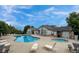 Resort-style community pool and spa area surrounded by lounge chairs at 3250 E 103Rd Pl # 805, Thornton, CO 80229