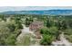 The property features a house surrounded by trees and a view of the mountains at 8403 Homestake Ct, Larkspur, CO 80118