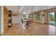 Finished basement with dining area, wood floors, and natural light at 8403 Homestake Ct, Larkspur, CO 80118