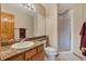Bathroom with granite countertops, shower, and neutral colored walls at 8403 Homestake Ct, Larkspur, CO 80118