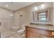 Bathroom with a walk in shower and granite counter top at 8403 Homestake Ct, Larkspur, CO 80118
