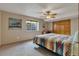 Bedroom with a fan and large window for natural light at 8403 Homestake Ct, Larkspur, CO 80118