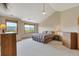Spacious bedroom with large windows offering scenic views, a ceiling fan, and neutral carpeting at 8403 Homestake Ct, Larkspur, CO 80118