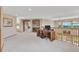 Bright bonus room with desk, neutral carpet, arched doorways, and natural light at 8403 Homestake Ct, Larkspur, CO 80118
