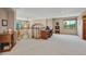 Open bonus room with a desk area, natural lighting, and views of the surrounding landscape at 8403 Homestake Ct, Larkspur, CO 80118