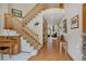 Inviting entrance hall with staircase leading to the upper level of the home at 8403 Homestake Ct, Larkspur, CO 80118