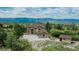 Stunning exterior of home with an attached garage and a small outbuilding at 8403 Homestake Ct, Larkspur, CO 80118