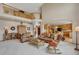 Open-concept floor plan with a living room that leads to a dining area and kitchen with hardwood floors at 8403 Homestake Ct, Larkspur, CO 80118
