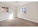 Empty bedroom featuring neutral carpet and bright white walls at 7845 Olive St, Commerce City, CO 80022