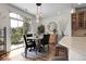 Cozy dining area with backyard views, stylish lighting, and modern decor at 10152 Bluffmont Ln, Lone Tree, CO 80124