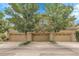 Three attached garages in front of stucco home offer convenient parking at 10152 Bluffmont Ln, Lone Tree, CO 80124