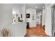Bright foyer with hardwood floors and elegant decor leading to the main living areas at 10152 Bluffmont Ln, Lone Tree, CO 80124
