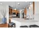 Stylish kitchen showcases granite countertops, wooden cabinets, stainless steel appliances, and pendant lighting at 10152 Bluffmont Ln, Lone Tree, CO 80124