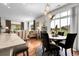 Cozy dining and living room area with backyard views and kitchen access at 10152 Bluffmont Ln, Lone Tree, CO 80124