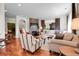 This bright living room features a fireplace, plush seating, and backyard views at 10152 Bluffmont Ln, Lone Tree, CO 80124