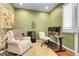 Cozy home office features plush seating and a practical workspace at 10152 Bluffmont Ln, Lone Tree, CO 80124