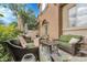 Inviting patio area for relaxing with outdoor furniture and shade umbrellas at 10152 Bluffmont Ln, Lone Tree, CO 80124