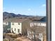 View of neighboring homes and stunning mountain views as seen from the backyard of this property at 9534 Elk Mountain Cir, Littleton, CO 80125