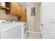 Bright laundry room with a washer and dryer and plenty of built-in cabinet space at 9534 Elk Mountain Cir, Littleton, CO 80125